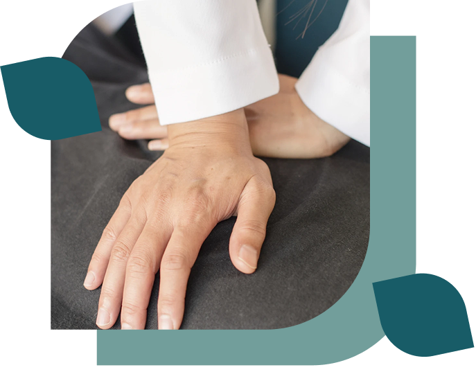 Hands pressing on a surface, therapy session.