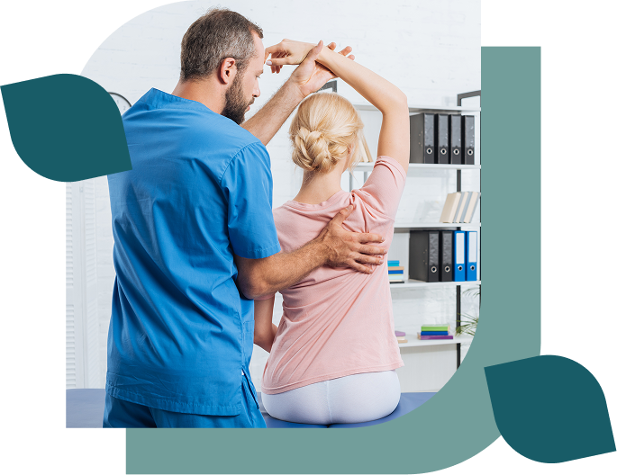 Physical therapist assisting woman with arm stretch.